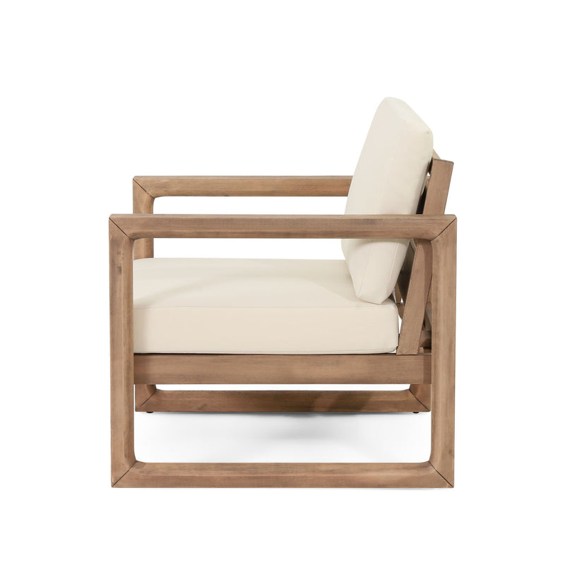 Noble House 4-piece outdoor acacia wood patio furniture set with coffee table, deep seating porch chairs and beige cushions.