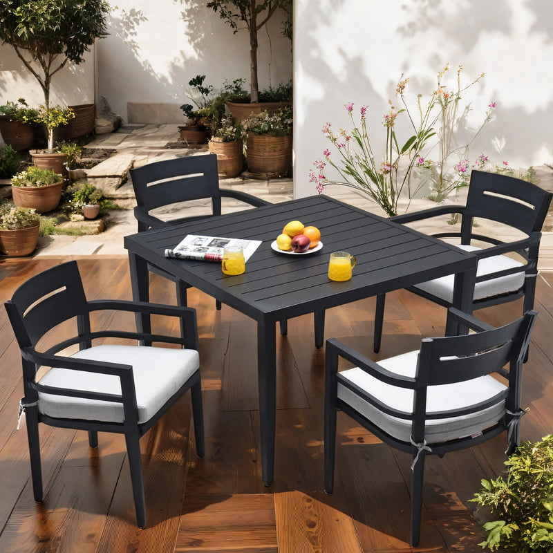 Modern 7-piece outdoor dining set by Life Outside with Sunbrella cushioned chairs, dining table with umbrella hole, ideal for outdoor meals.