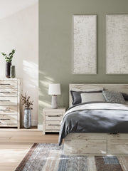 Signature Design by Ashley Lawroy panel bed with built-in storage drawers and a modern wood finish.