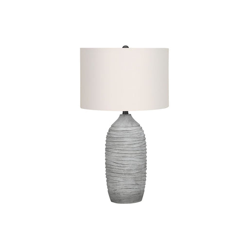 Modern gray and cream resin table lamp by 8th Street with sleek, contemporary design and soft lighting.