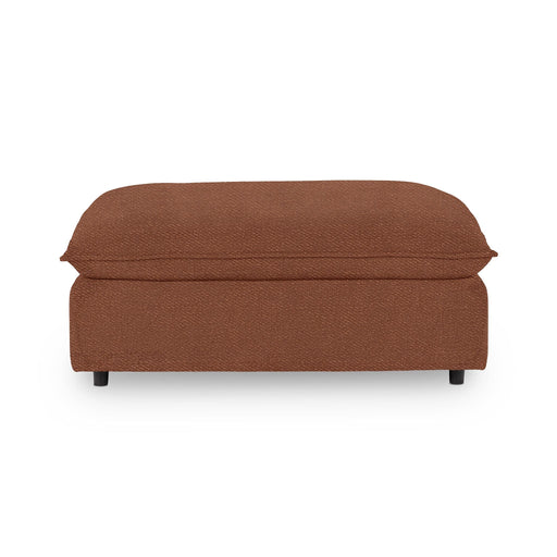 Classic Home Caplan upholstered ottoman with plush fabric and wooden legs, serving as a stylish accent or footrest.
