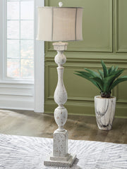 Signature Design by Ashley Madsbrook poly floor lamp with a modern base and fabric shade, ideal for living room or bedroom lighting.