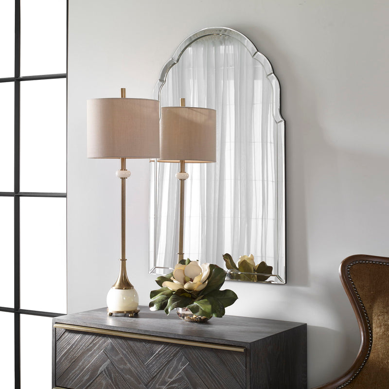 Uttermost Brayden frameless arched wall mirror with pearl silver finish, showcasing its elegant curved design and sleek frame.