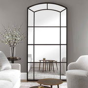 Black oversized arch mirror from Uttermost's Camber accent mirror collection, featuring a sleek, modern design with a bold black frame.