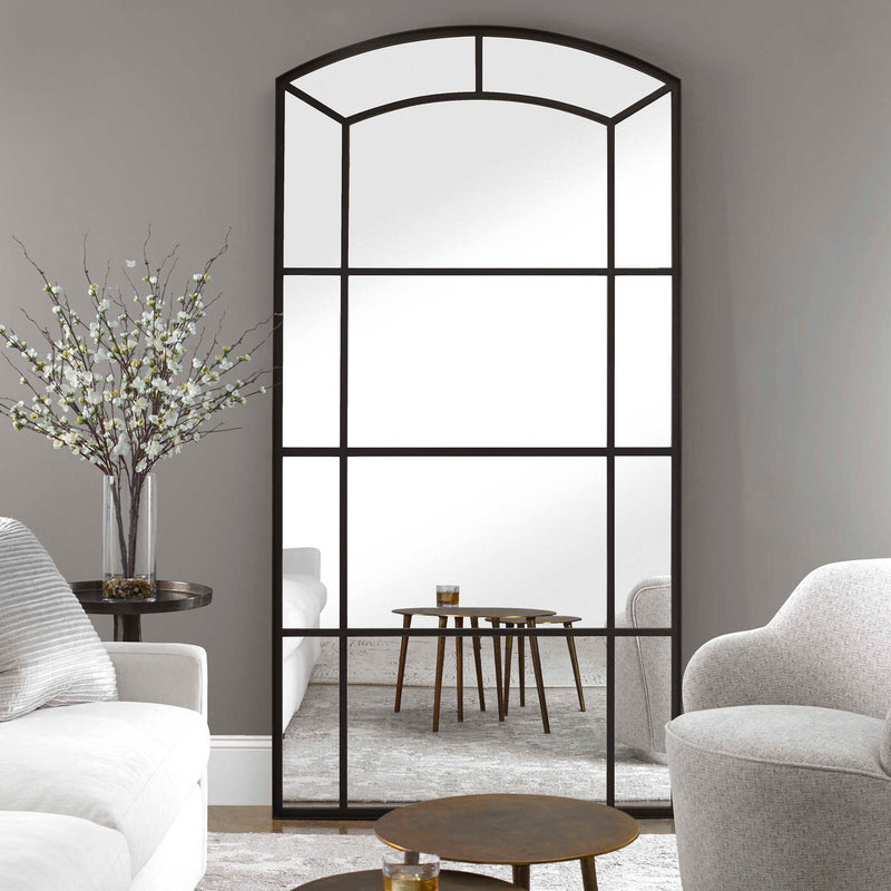 Black oversized arch mirror from Uttermost's Camber accent mirror collection, featuring a sleek, modern design with a bold black frame.
