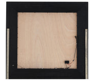 Metallic black mirror by Glory Furniture with a sleek modern frame, hanging on a wall in a contemporary setting.