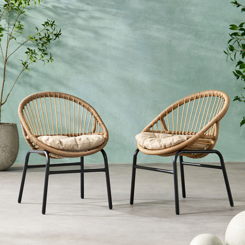 Set of two Noble House outdoor accent chairs with curved backs and basket frames in light brown and beige.