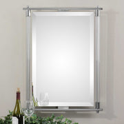 Uttermost Adara Pearl Silver vanity mirror with elegant round frame, reflecting light and showcasing its stylish, decorative design.
