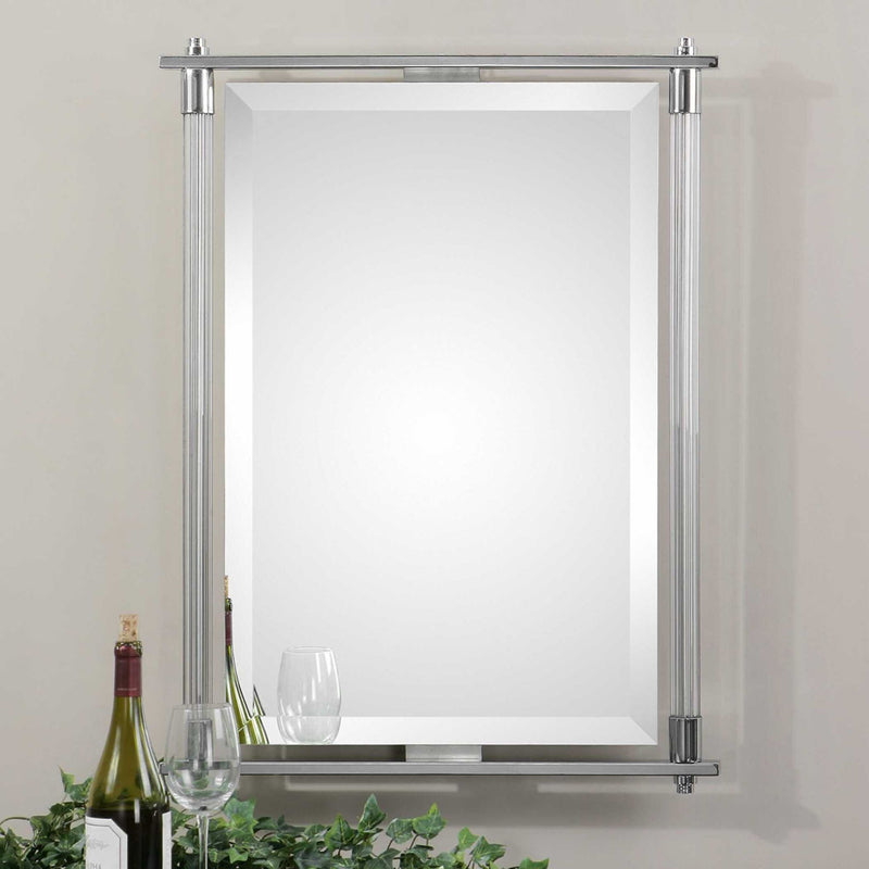 Uttermost Adara Pearl Silver vanity mirror with elegant round frame, reflecting light and showcasing its stylish, decorative design.