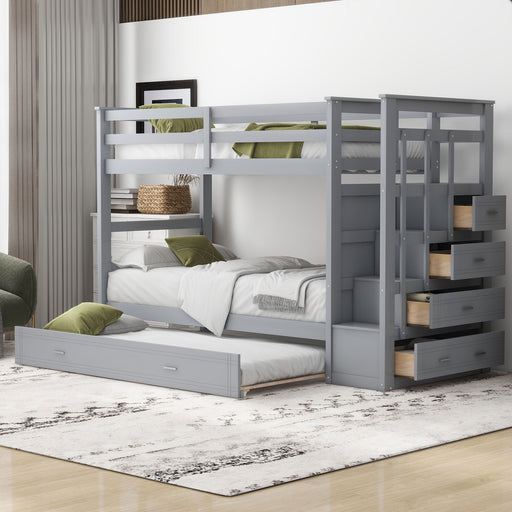 DreamHaus bunk bed with trundle and staircase, featuring sturdy wood construction and space-saving design for kids' bedrooms.