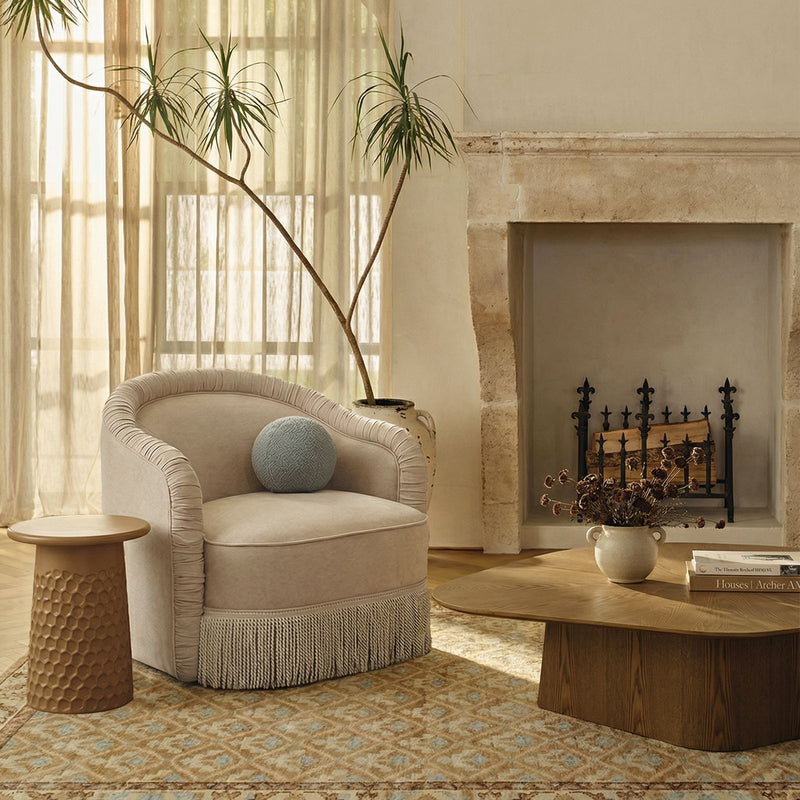 TOV Furniture Pamela chenille tassel lounge chair in tan with plush upholstery and decorative tassels, accentuating a stylish living space.