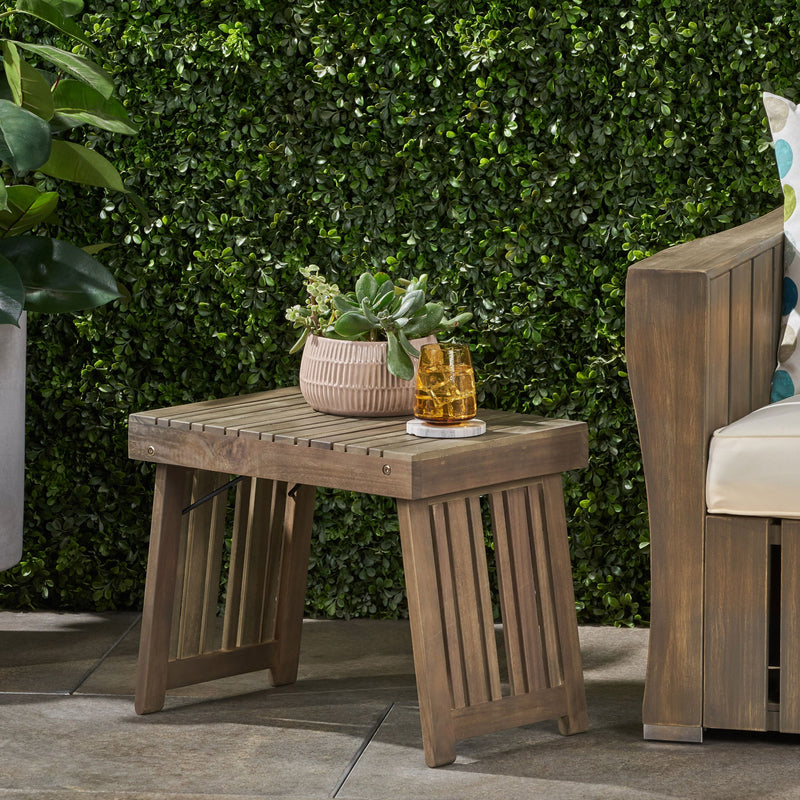 Noble House Temptation outdoor foldable side table with slat design, compact and versatile for patio or garden use.