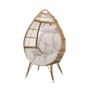 Noble House basket accent chair with teardrop shape and water-resistant cushion, natural woven rattan design for indoor or outdoor use.