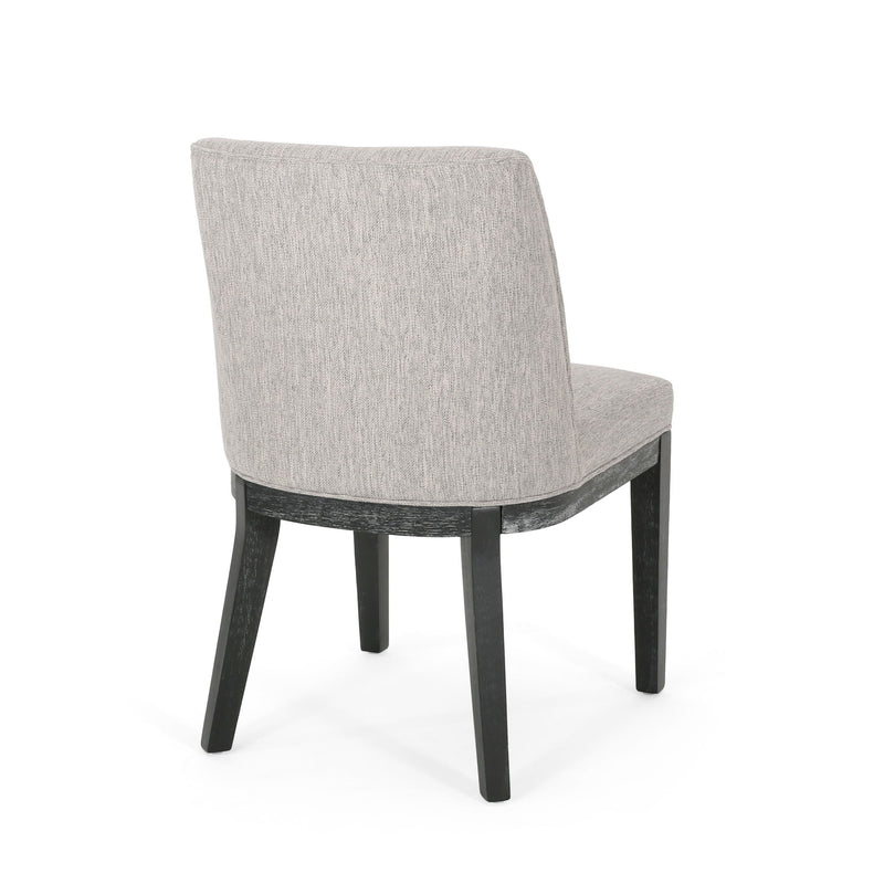 Set of two Noble House modern dining chairs with durable fabric upholstery and sturdy wooden frames.