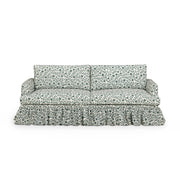 Gertrude TOV Furniture linen weave floral performance sofa with plush cushions and wooden legs, showcasing a stylish stationary sofa design.