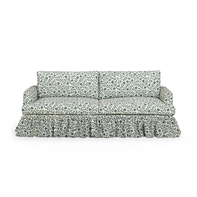 Gertrude TOV Furniture linen weave floral performance sofa with plush cushions and wooden legs, showcasing a stylish stationary sofa design.