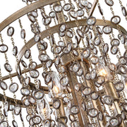 Uttermost Valka 6-light crystal chandelier with light brown finish, featuring elegant hanging crystal accents and a modern chandelier design.