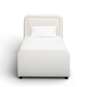 TOV Furniture Briella trundle bed with sleek wooden frame and pull-out storage or sleeping area, in a modern bedroom setting.