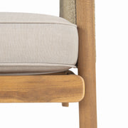 Noble House Sumbawa outdoor club arm chair with woven rattan frame and cushioned seat for patio relaxation.
