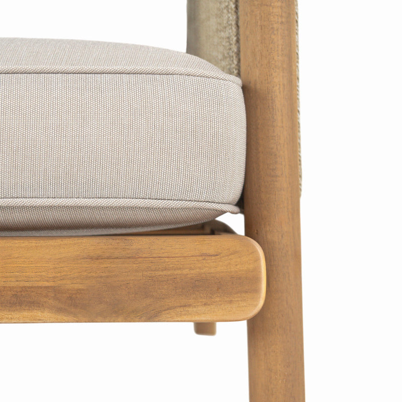 Noble House Sumbawa outdoor club arm chair with woven rattan frame and cushioned seat for patio relaxation.