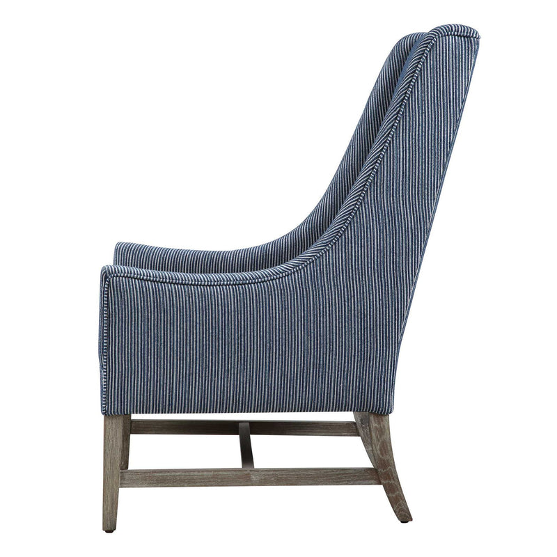 Blue Uttermost Galiot wingback accent chair with tufted upholstery and wooden legs, stylish and comfortable for living spaces.