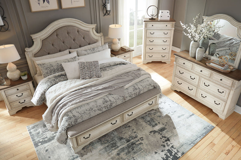 Signature Design by Ashley Realyn 5-piece storage bedroom set with bed, dresser, mirror, and nightstands in a modern bedroom scene.