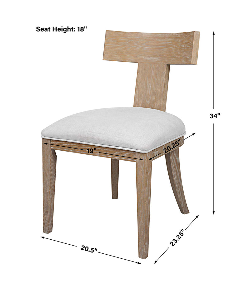 Uttermost Idris armless side chair with upholstered seat and sleek wooden legs, modern design for living or dining room.