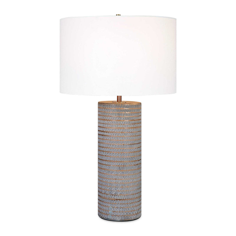 Uttermost Monolith gray table lamp with a modern, sculptural design, featuring a cylindrical base and fabric shade.