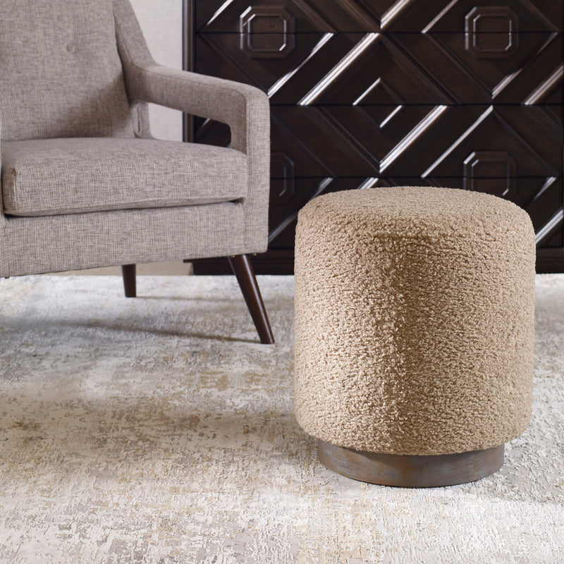 Uttermost Avila accent ottoman with upholstered fabric and wooden legs, versatile for living room or bedroom decor.