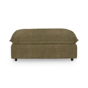 Classic Home Caplan upholstered ottoman with a soft fabric cover, showcasing a stylish and versatile piece for living room decor.