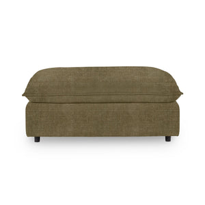 Classic Home Caplan upholstered ottoman with a soft fabric cover, showcasing a stylish and versatile piece for living room decor.