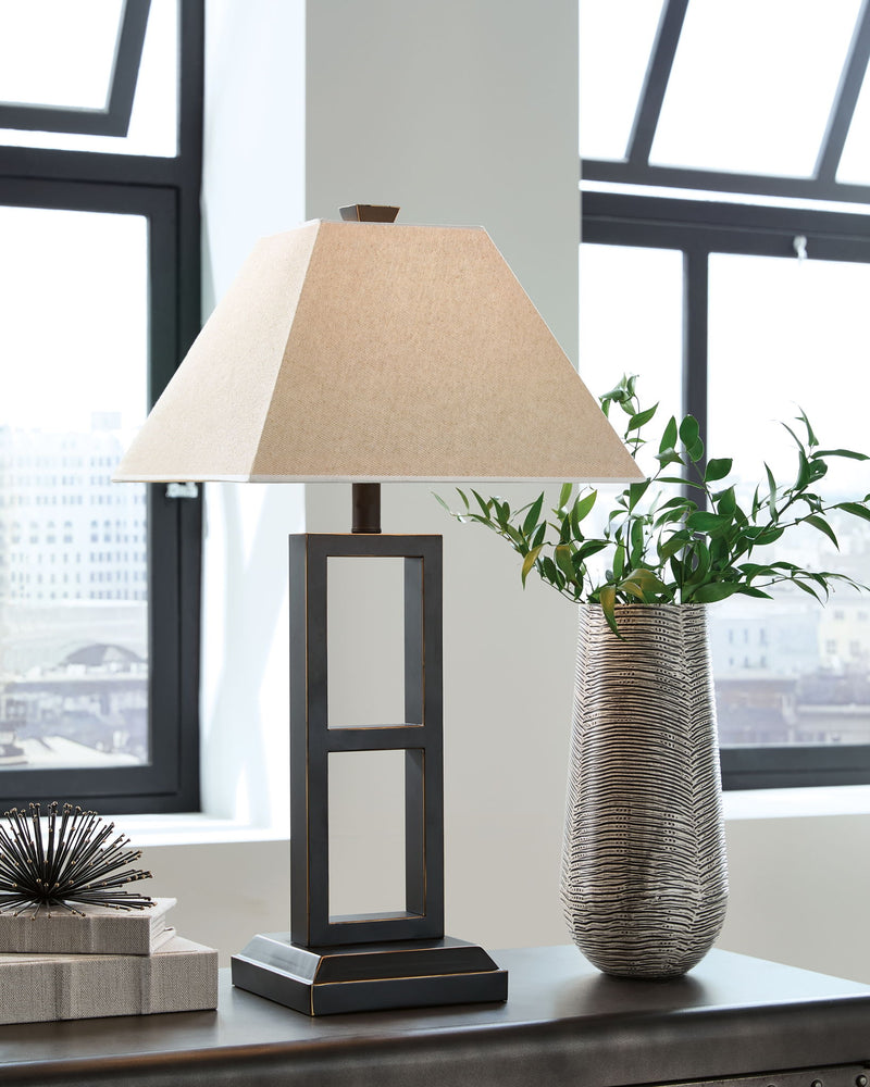 Pair of Deidra Table Lamps by Signature Design by Ashley®, featuring neutral fabric shades and sleek ceramic bases.