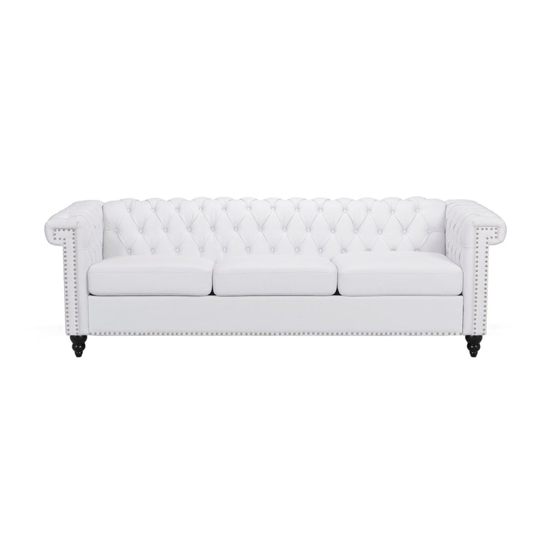 Noble House Chesterfield style 3-seater sofa with deep button tufting and plush upholstery, stationary design in a classic living room setting.