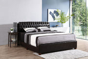 Dark brown upholstered King bed from Glory Furniture with a plush headboard and sturdy wooden frame.