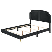 Zeena upholstered bed by ACME with a plush headboard and neutral fabric, showcasing a modern bedroom design.