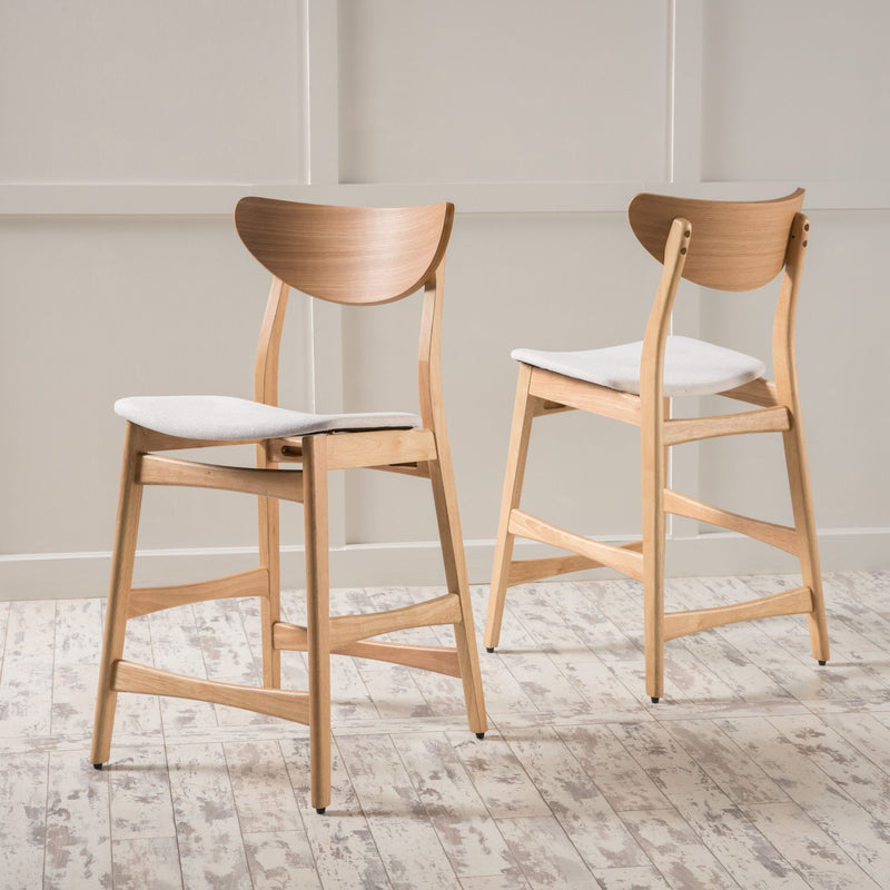 Noble House retro modern counter height stool set with cushioned seats, showcasing sleek design and wooden legs in a contemporary style.