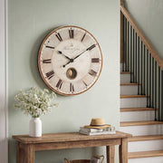 Uttermost Harrison Gray wall clock featuring a modern round design with a sleek gray finish and minimalist clock face.