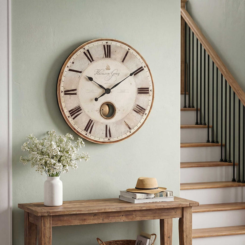 Uttermost Harrison Gray wall clock featuring a modern round design with a sleek gray finish and minimalist clock face.