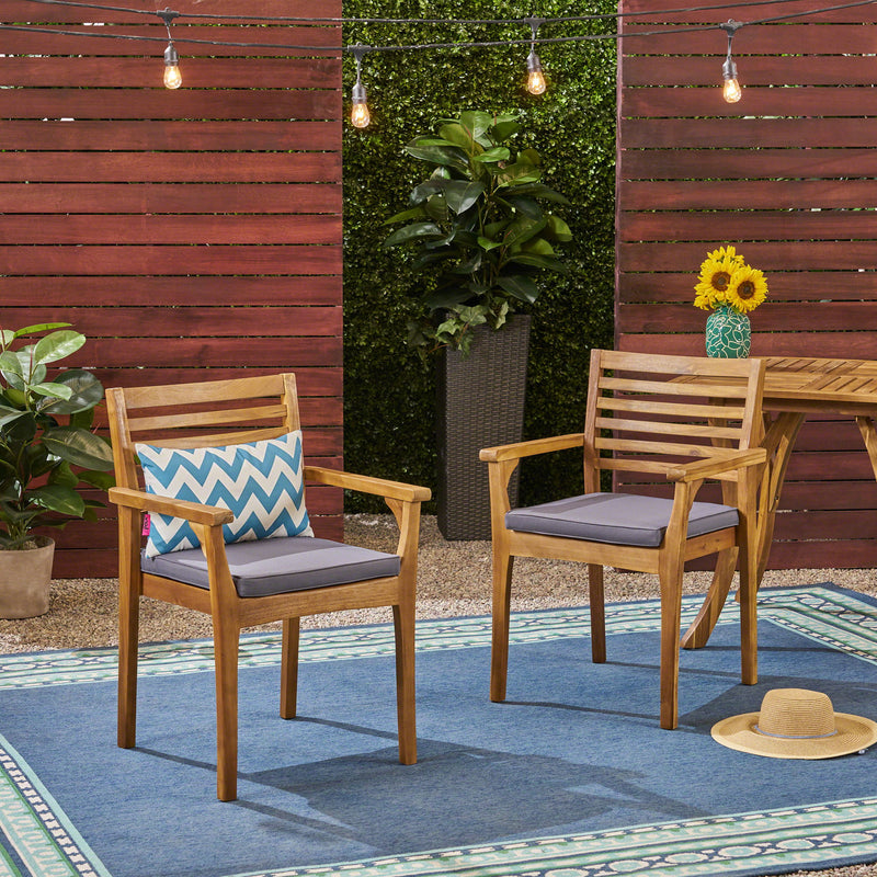 Set of two outdoor dining chairs with gray slat back and acacia wood frames, suitable for patio or garden dining.