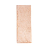 Classic Home Taiga throw blanket with textured fabric in neutral tones, perfect for cozying up on the sofa.