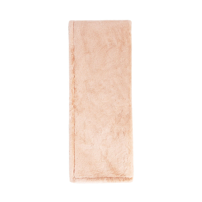 Classic Home Taiga throw blanket with textured fabric in neutral tones, perfect for cozying up on the sofa.