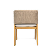 Set of two Noble House patio dining chairs in light teak finish, outdoor furniture with slatted back and armrests.
