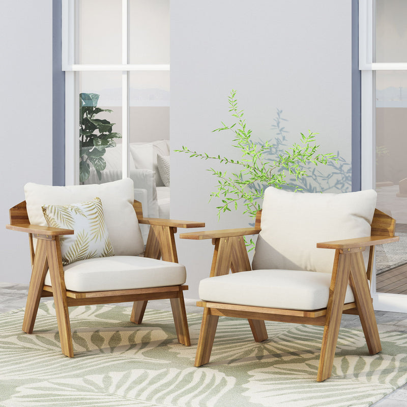 Set of two outdoor acacia wood club chairs with beige cushions by Noble House, featuring teak finish and comfortable armrests.