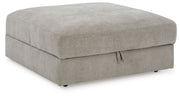 Benchcraft® Aslan Court 5-piece sectional with ottoman set in neutral fabric, showcasing plush cushions and modern design.