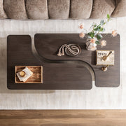 Classic Home Melina coffee table with a sleek wooden surface and modern design, perfect for living room decor.
