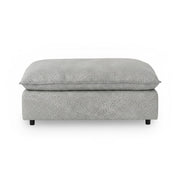Classic Home Caplan upholstered ottoman with plush fabric and sturdy wooden legs, versatile for living room or bedroom decor.