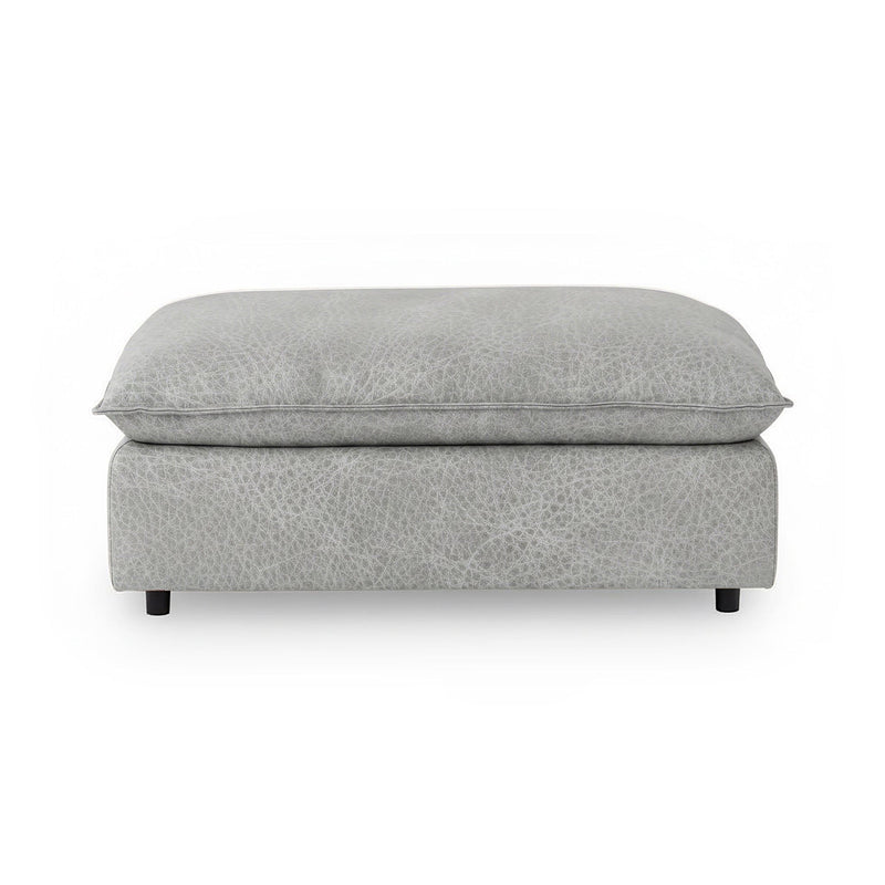 Classic Home Caplan upholstered ottoman with plush fabric and sturdy wooden legs, versatile for living room or bedroom decor.