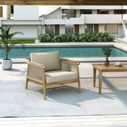 Noble House Sumbawa outdoor club arm chair with woven rattan-style frame and plush cushions, perfect for patio seating.