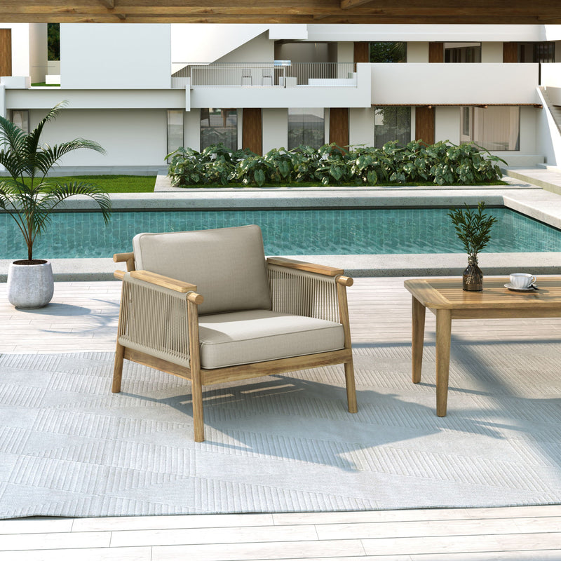 Noble House Sumbawa outdoor club arm chair with woven rattan-style frame and plush cushions, perfect for patio seating.