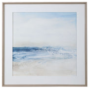 Framed print titled "Surf And Sand" by Uttermost featuring a calming blue ocean scene in a sleek frame.